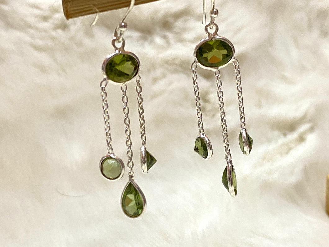 Peridot dangle earrings in silver.