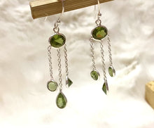 Load and play video in Gallery viewer, Peridot dangle earrings in silver.
